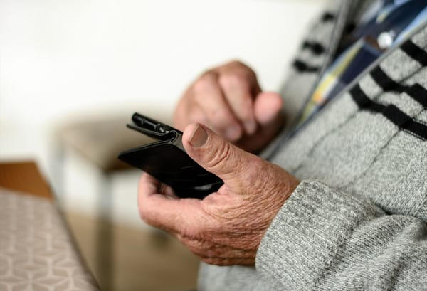 a senior using a mobile phone