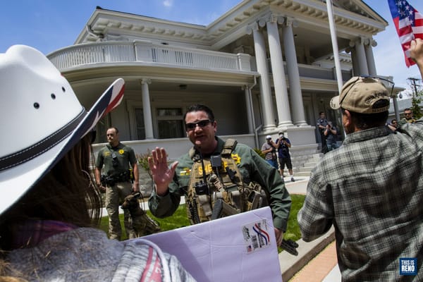 Law enforcement kept back protesters May 2 at the Governor's Mansion during a protest to reopen Nevada and recall Gov. Sisola
