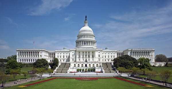 The western front of the United States Capitol. The Neoclassical style building is located in Washington, D.C., on top of Cap