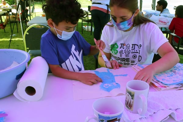 Joseph M., from Washoe County, learns how to do batik, a method of dying cloth using wax and dye, at a 4-H STEAM Day Camp dur