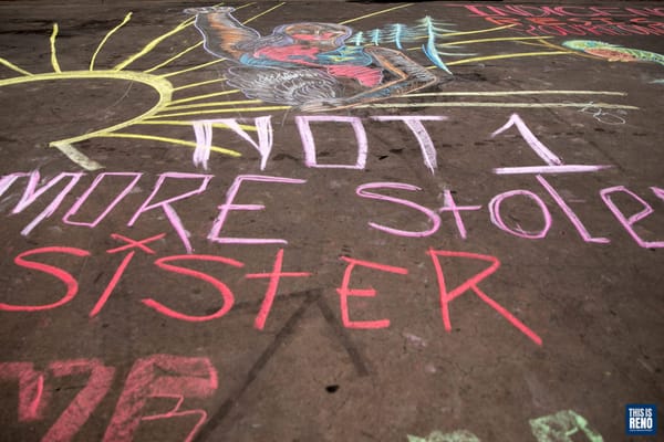 Chalk art created as part of a Rage Against Colonialism demonstration Oct. 11, 2020 in Reno, Nev.