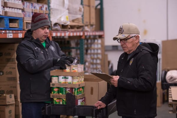 Food Distribution Program on Indian Reservations (FDPIR) staff work in the warehouse on the Lummi reservation in Washington s