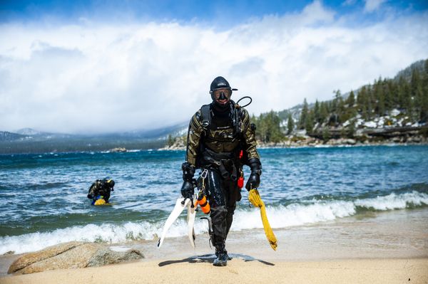 Divers from Clean Up The Lake exit the chilly Lake Tahoe waters near Sand Harbor.